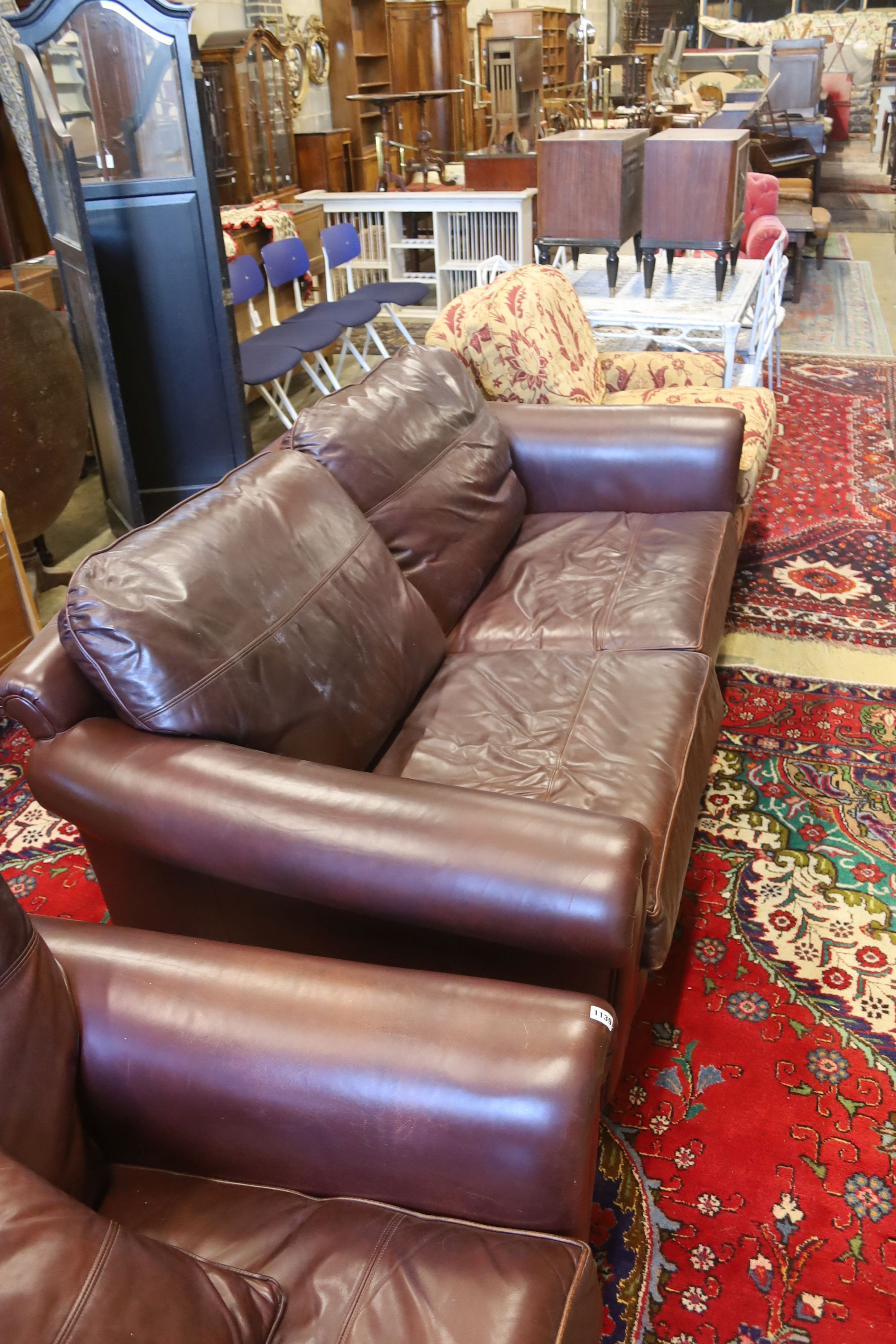 A Duresta brown leather settee and matching armchair, settee length 210cm, depth 102cm, height 90cm